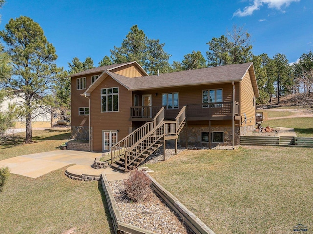24354 Rushmore Ranch Rd, Keystone, SD 57751 - rear view of house featuring stone siding, a patio, stairs, a deck, and a yard