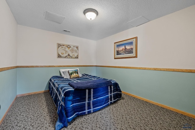 24354 Rushmore Ranch Rd, Keystone, SD 57751 - carpeted bedroom with baseboards and a textured ceiling