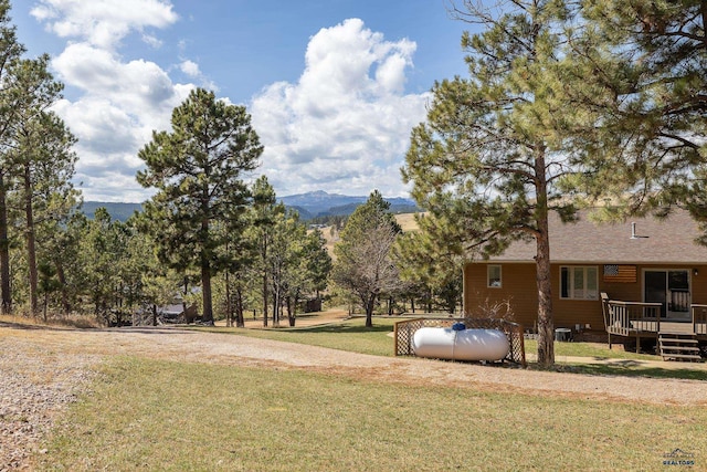 24354 Rushmore Ranch Rd, Keystone, SD 57751 - view of yard featuring a deck with mountain view