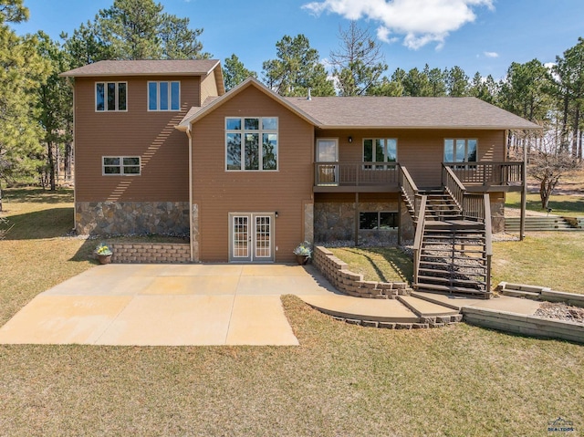 24354 Rushmore Ranch Rd, Keystone, SD 57751 - back of property featuring stone siding, stairway, a deck, a lawn, and french doors