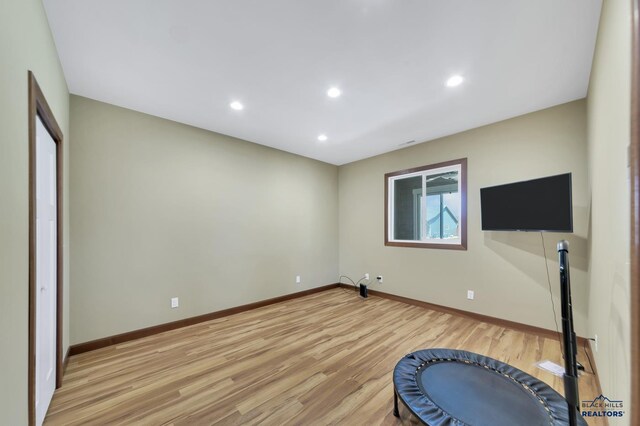 3129 Hazelnut Ln, Rapid City, SD 57703 - exercise room with recessed lighting, baseboards, and light wood finished floors