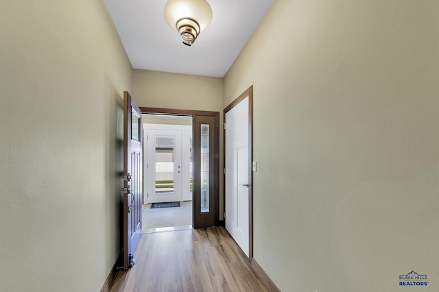 3129 Hazelnut Ln, Rapid City, SD 57703 - corridor featuring baseboards and wood finished floors