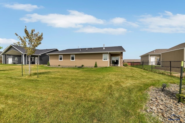 3129 Hazelnut Ln, Rapid City, SD 57703 - back of house with a yard and fence