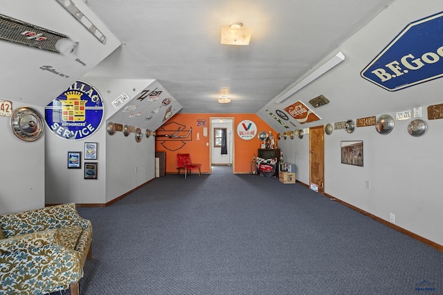 playroom featuring baseboards, vaulted ceiling, and carpet