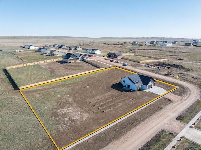 birds eye view of property featuring a rural view