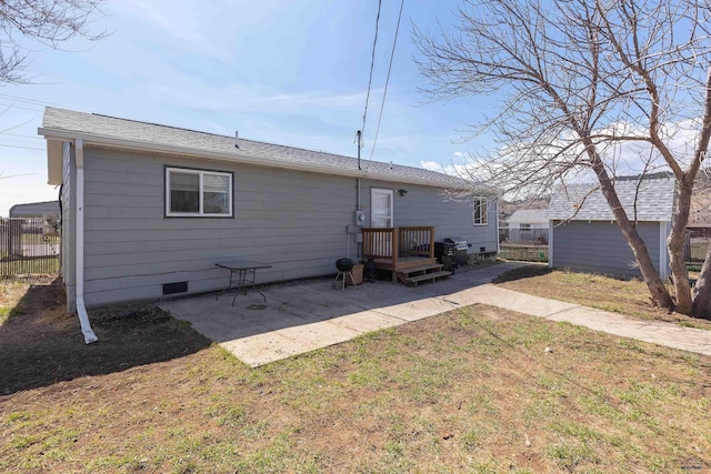 524 Mall Dr, Rapid City, SD 57701 - back of property featuring a yard, crawl space, fence, and a patio