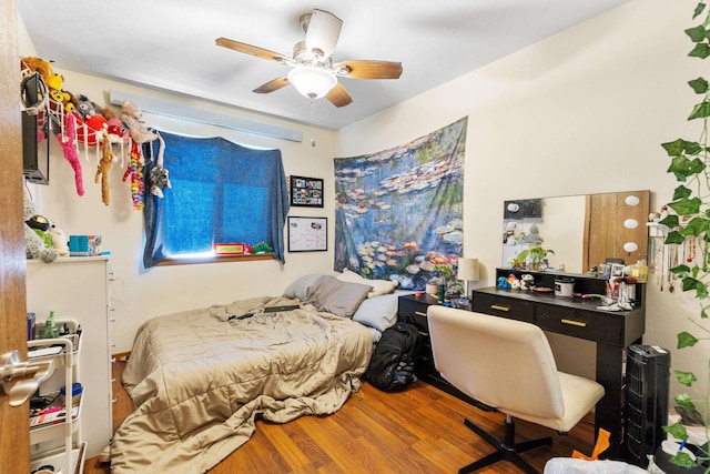 524 Mall Dr, Rapid City, SD 57701 - bedroom featuring wood finished floors and a ceiling fan