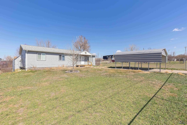 524 Mall Dr, Rapid City, SD 57701 - exterior space featuring fence and a detached carport