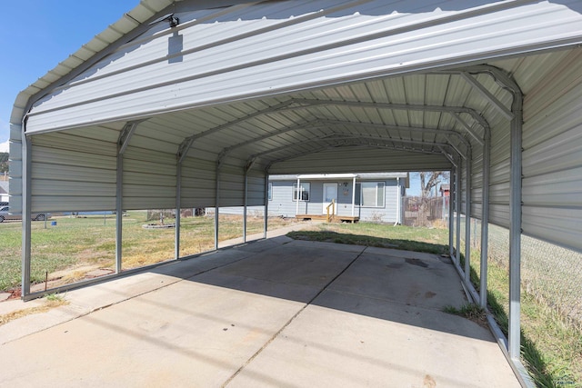524 Mall Dr, Rapid City, SD 57701 - view of parking / parking lot featuring a detached carport
