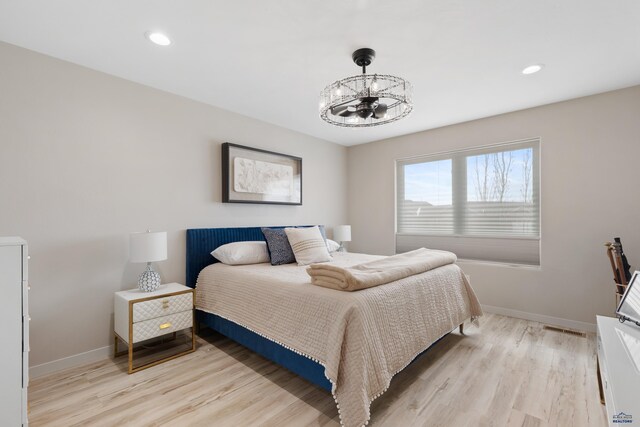 4403 Targhee Dr, Rapid City, SD 57702 - bedroom featuring recessed lighting, baseboards, a chandelier, light wood finished floors, and visible vents