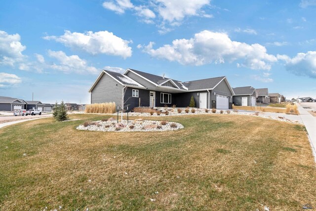 4403 Targhee Dr, Rapid City, SD 57702 - view of front of home with driveway, an attached garage, a front yard, and a residential view