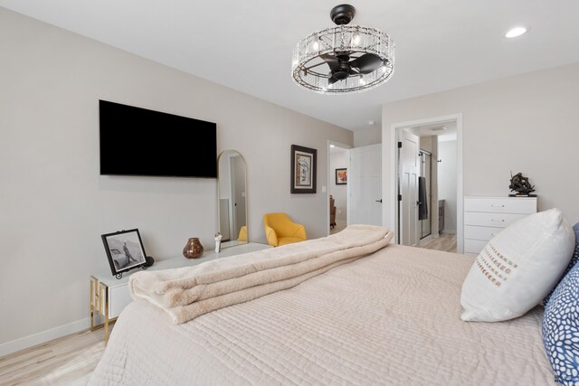 4403 Targhee Dr, Rapid City, SD 57702 - bedroom featuring baseboards, light wood-style flooring, recessed lighting, and a notable chandelier