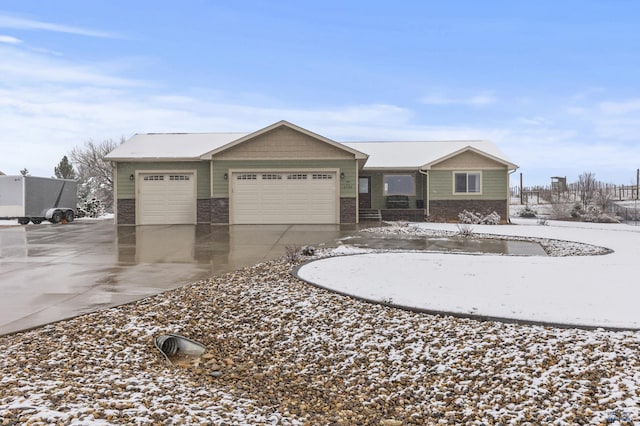 2750 Tumble Weed Trl, Spearfish, SD 57783 - ranch-style house featuring an attached garage, stone siding, and driveway