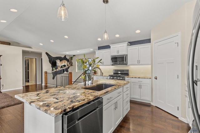 2750 Tumble Weed Trl, Spearfish, SD 57783 - kitchen with appliances with stainless steel finishes, vaulted ceiling, white cabinets, dark wood finished floors, and a sink