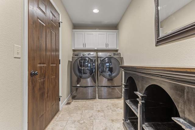2750 Tumble Weed Trl, Spearfish, SD 57783 - clothes washing area featuring baseboards, cabinet space, and washer and clothes dryer