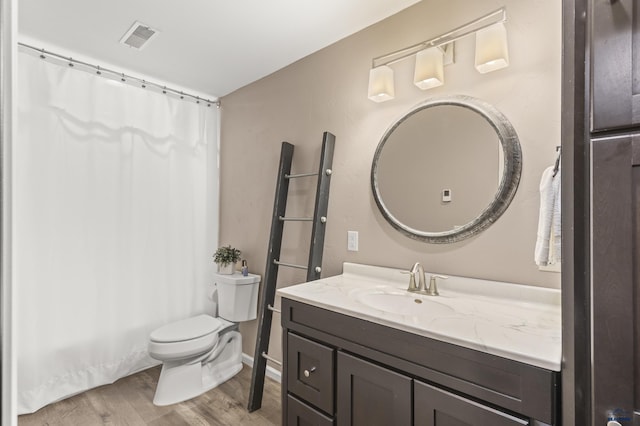 2750 Tumble Weed Trl, Spearfish, SD 57783 - full bathroom featuring vanity, visible vents, toilet, curtained shower, and wood finished floors