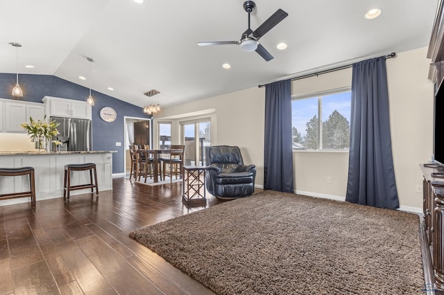 2750 Tumble Weed Trl, Spearfish, SD 57783 - living area with dark wood-style flooring, ceiling fan, a wealth of natural light, and vaulted ceiling