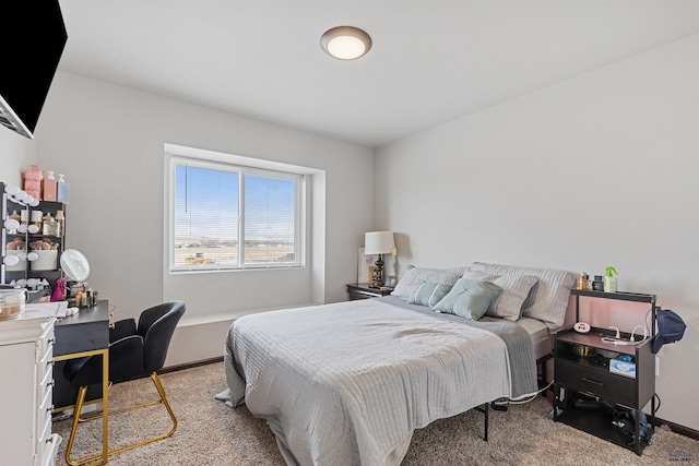 carpeted bedroom with baseboards