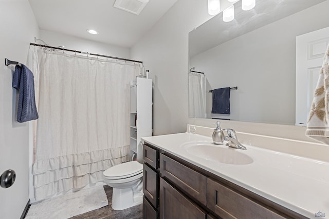 full bath with visible vents, toilet, curtained shower, and vanity