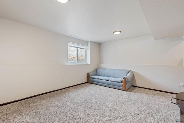 living area with carpet, visible vents, and baseboards