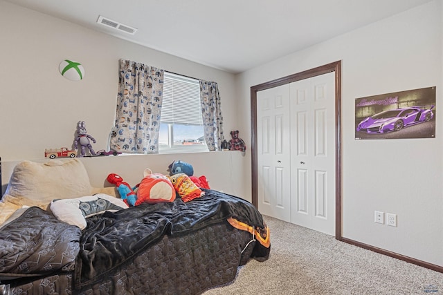 bedroom featuring visible vents, carpet flooring, and a closet