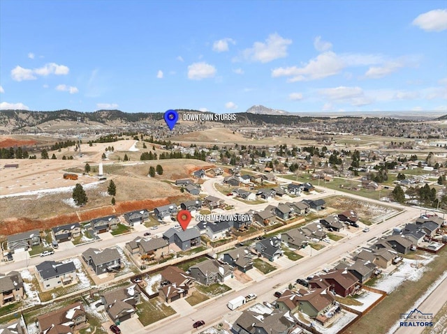 2678 Meadows Dr, Sturgis, SD 57785 - drone / aerial view with a residential view and a mountain view