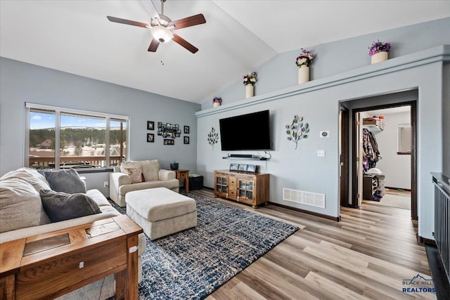 2678 Meadows Dr, Sturgis, SD 57785 - living room featuring baseboards, a ceiling fan, visible vents, lofted ceiling, and light wood finished floors
