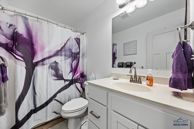 2678 Meadows Dr, Sturgis, SD 57785 - bathroom with visible vents, toilet, and vanity
