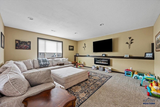 2678 Meadows Dr, Sturgis, SD 57785 - living area featuring visible vents, carpet floors, a glass covered fireplace, and a textured ceiling