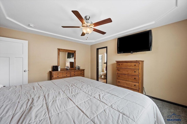 2678 Meadows Dr, Sturgis, SD 57785 - carpeted bedroom featuring baseboards, a ceiling fan, connected bathroom, and a raised ceiling
