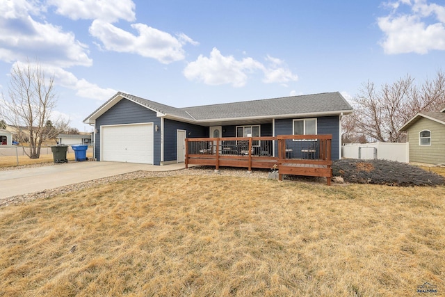 ranch-style house with concrete driveway, a front lawn, fence, and an attached garage