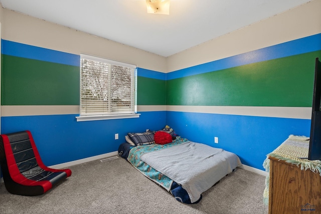 bedroom with carpet flooring, baseboards, and visible vents