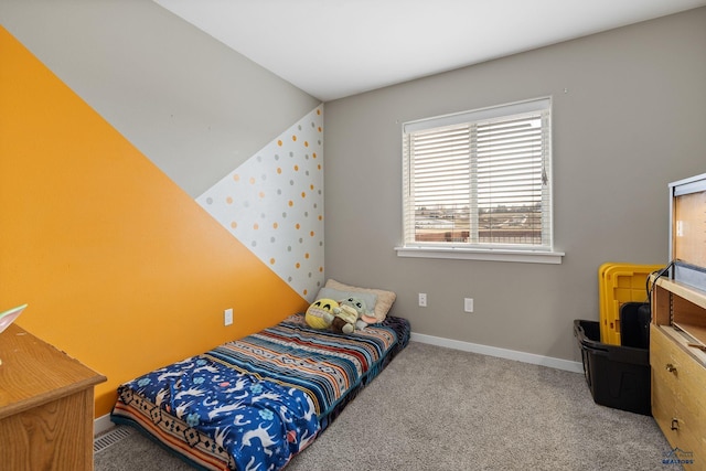 bedroom featuring carpet floors and baseboards