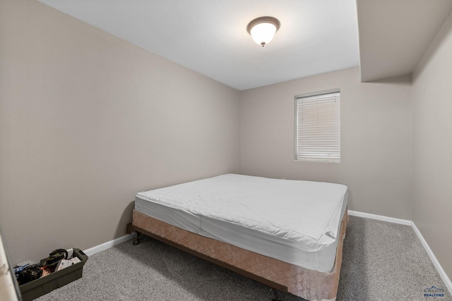 carpeted bedroom with baseboards