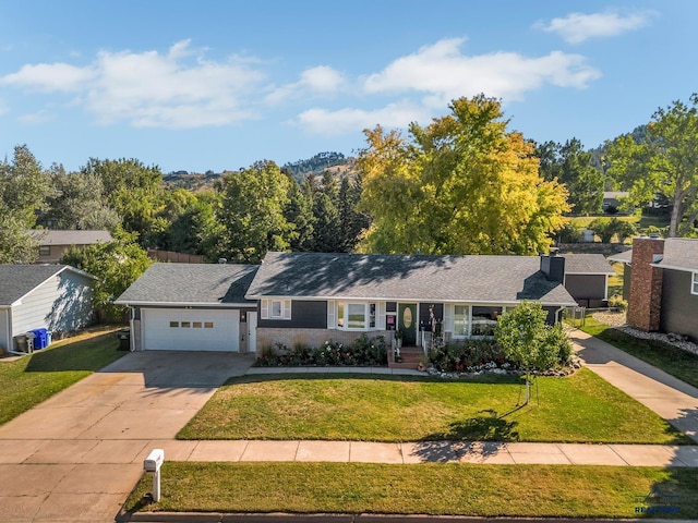 3112 Flint Dr, Rapid City, SD 57702 - ranch-style house featuring an attached garage, driveway, and a front lawn