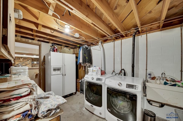 3112 Flint Dr, Rapid City, SD 57702 - washroom with a sink, washing machine and clothes dryer, and laundry area