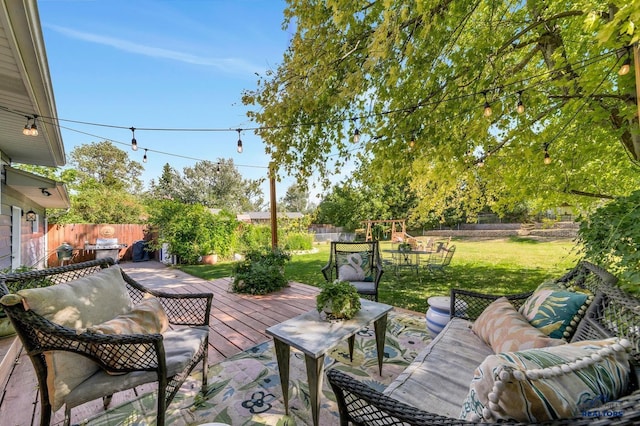 3112 Flint Dr, Rapid City, SD 57702 - view of patio featuring a wooden deck, a fenced backyard, and a playground