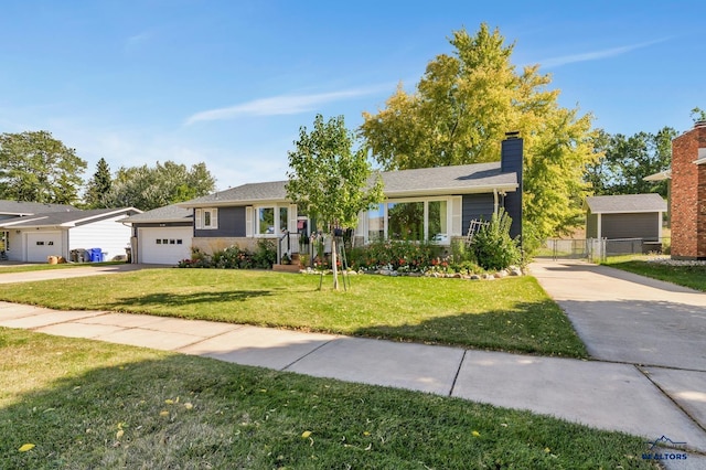 3112 Flint Dr, Rapid City, SD 57702 - ranch-style home with a chimney, driveway, a front lawn, a garage, and a gate