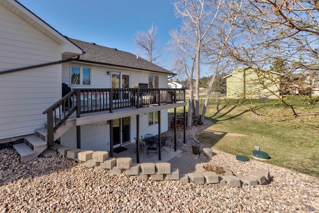 back of house with a patio area, a yard, a wooden deck, and a shingled roof
