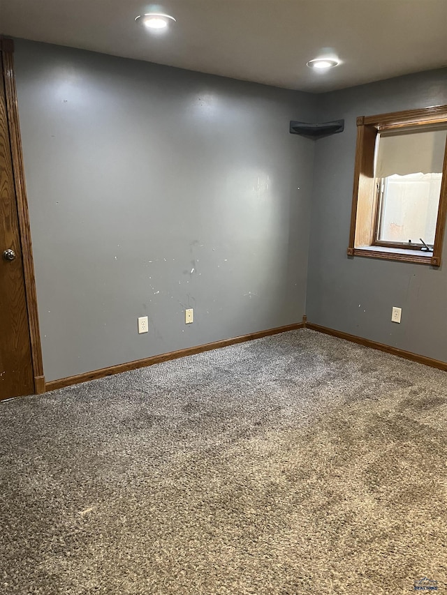 unfurnished room with recessed lighting, carpet, and baseboards