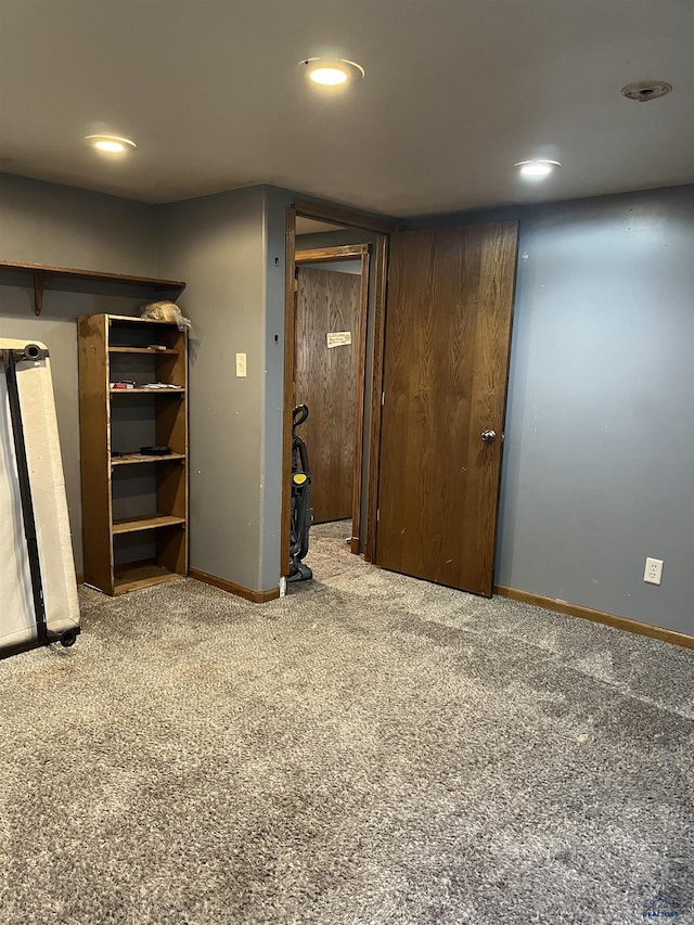 unfurnished bedroom with recessed lighting, carpet flooring, and baseboards