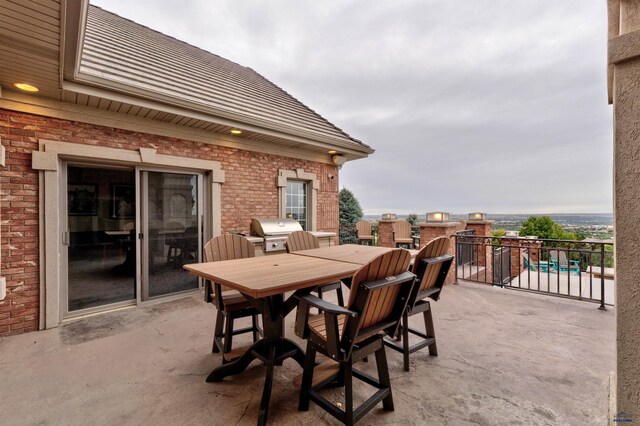1334 Alta Vista Dr, Rapid City, SD 57701 - view of patio / terrace with area for grilling, outdoor dining space, and a balcony