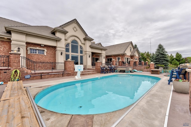 1334 Alta Vista Dr, Rapid City, SD 57701 - view of swimming pool with a fenced in pool