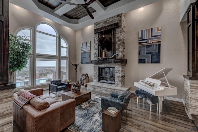 1334 Alta Vista Dr, Rapid City, SD 57701 - living area featuring a fireplace, plenty of natural light, a ceiling fan, coffered ceiling, and wood finished floors