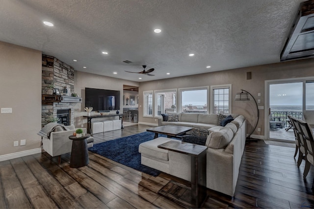 1334 Alta Vista Dr, Rapid City, SD 57701 - living room featuring a textured ceiling, wood finished floors, and a ceiling fan