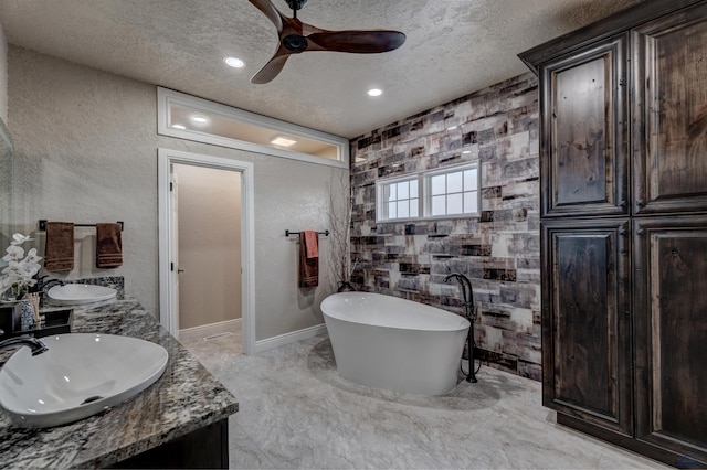 1334 Alta Vista Dr, Rapid City, SD 57701 - full bath featuring a sink, a freestanding bath, a ceiling fan, and a textured ceiling