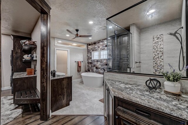 1334 Alta Vista Dr, Rapid City, SD 57701 - full bath with vanity, a stall shower, a soaking tub, a ceiling fan, and visible vents