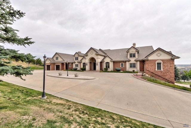 1334 Alta Vista Dr, Rapid City, SD 57701 - french provincial home featuring curved driveway and brick siding