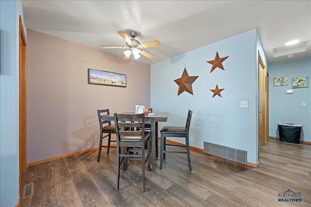322 Summit, Belle Fourche, SD 57717 - dining room with wood finished floors, visible vents, and ceiling fan