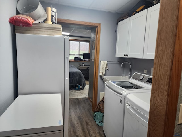322 Summit, Belle Fourche, SD 57717 - laundry area with dark wood finished floors, independent washer and dryer, a sink, and cabinet space